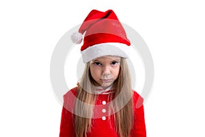 Serious and angry christmas girl wearing a santa hat isolated over a white background