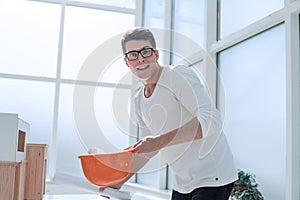 Serious architect studying the drawing of a new project.