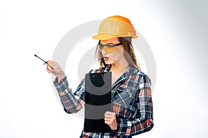 Serious attractive architect woman with hard hat. Isolated on white background