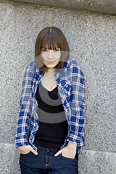 Serious attractive teen girl in chequered shirt