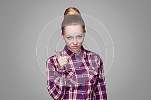 Serious beautiful blonde girl in red, pink checkered shirt, coll