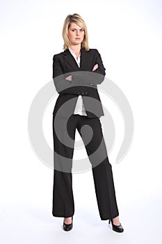 Serious blonde woman in business suit arms folded