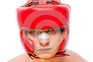 Serious boxers face in a red helmet