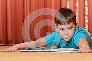 Serious boy with a book