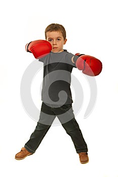 Serious boy with boxing gloves