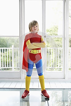 Serious Boy In Superhero Costume Indoors