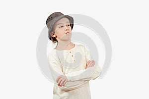 Serious boy thinking isolated on white background. Positive teen boy crossing arms