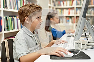 Serious Boy using Pc in Programming Class For Kids