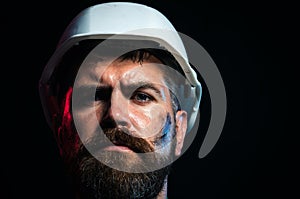 Serious builder in hardhat. Foreman or repairman in safety helmet. Construction worker in hard hat. Bearded man in