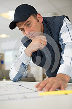 Serious builder looking at plan