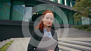 Serious business girl walking in city Caucasian businesswoman walk outdoors employer company manager entrepreneur lady