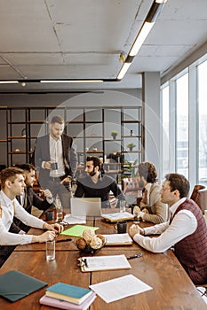 Serious business people hold meeting in office