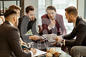 Serious business people hold meeting in office