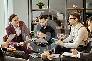 Serious business people hold meeting in office