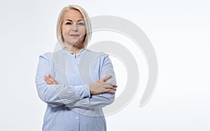 Serious business woman with folded arms on white background