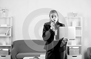 Serious business woman, office manager with phone at office desk. Businesswoman entrepreneur working in office