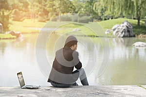 Serious business woman work hard with serious problem in a public park