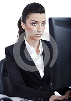 Serious business woman working in computer