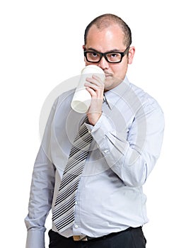 Serious businessman drinking coffee