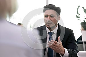 Serious businessman explaining business plan to female financial advisor