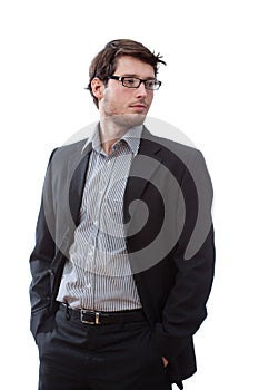 Serious businessman with hands in pockets