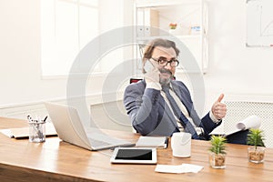 Serious businessman having phone talk