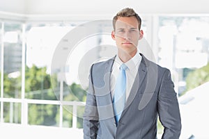 Serious businessman looking at camera