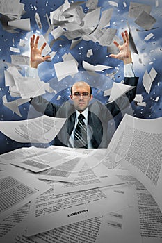 Serious businessman manipulating papers