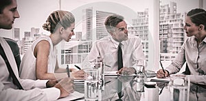 Serious businessman during a meeting talking to his employees