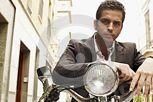 Serious Businessman On Motorbike
