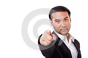 Serious businessman pointing at you