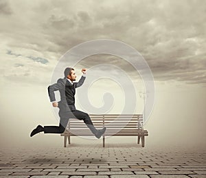 Serious businessman running at outdoor