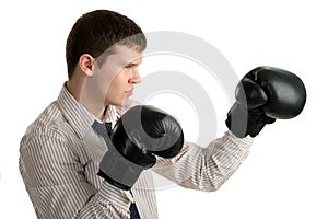 Serious businessman in sports boxing stance