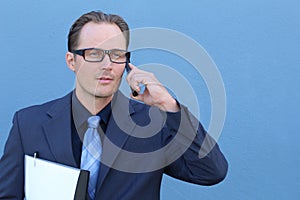 Serious businessman talking on the phone