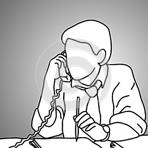 Serious businessman using desk telephone with a pencil on his le