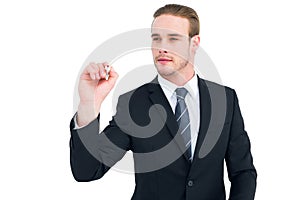 Serious businessman writing with marker