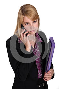 Serious businesswoman with files