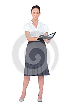 Serious businesswoman holding her datebook