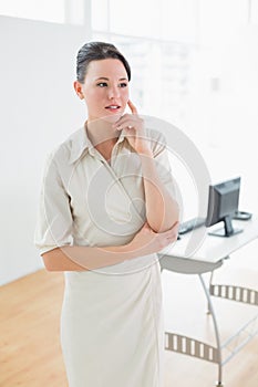 Serious businesswoman looking away in office