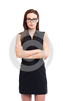 Serious businesswoman looking into camera isolated
