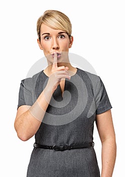 Serious Businesswoman Making Shhh Gesture photo