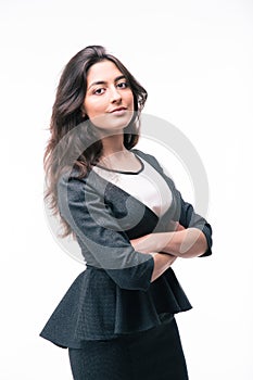 Serious businesswoman standing with arms folded