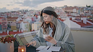 Serious businesswoman working cityscape balcony closeup. Lady typing computer