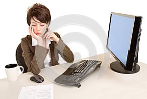 Serious Businesswoman Working at her Desk