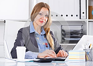 Serious businesswoman working in office