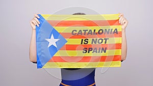 Serious catalan woman with estelada flag. Referendum For The Separation Of Catalonia From Spain