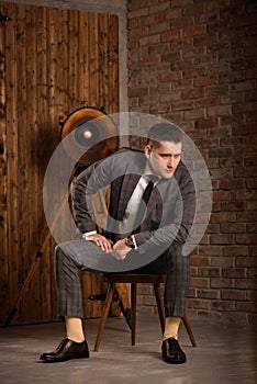 Serious Caucasian man with short black hair in business formal outfit