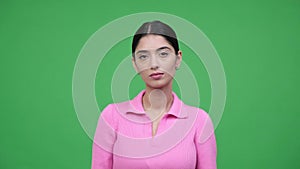 Serious Caucasian Woman Portrait on Green Background