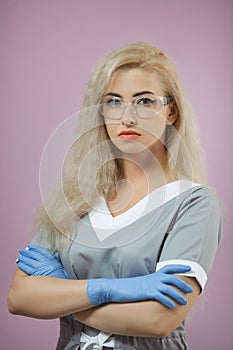 Serious Caucausian female doctor arms crossed