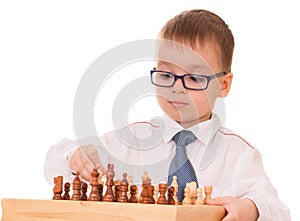 Serious child playing chess
